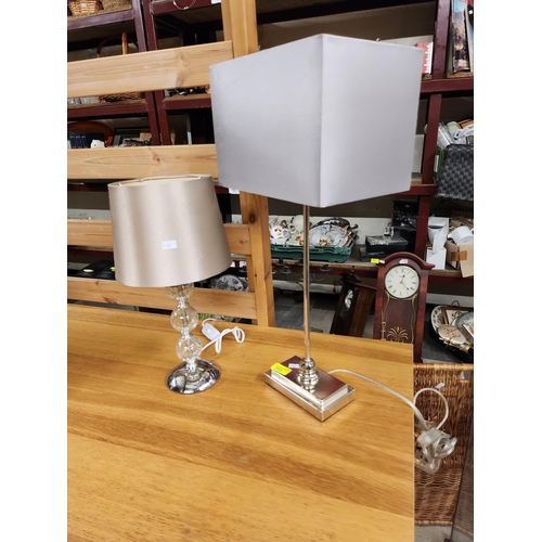 713 - 2 Modern crome and glass lamps with satin shades