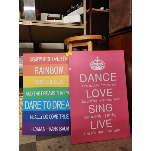 587 - Two decorative wall art canvases including ‘Dance, love, sing, live’ and ‘Somewhere over the rainbow... 