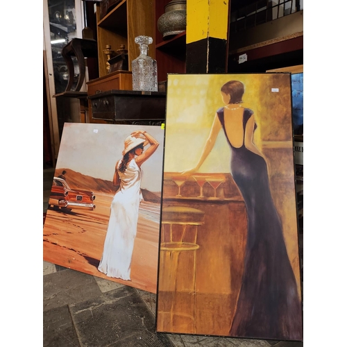 588 - Two large wall canvases depicting women