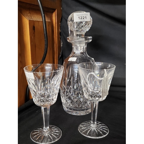 1221 - A Waterford crystal Lismore decanter and two wine glasses