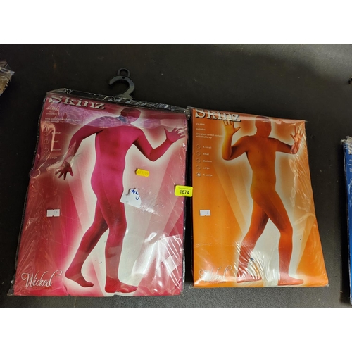 1674 - Two brand new wicked costumes Skinz suits in size XL RRP19.99 each. One pink and one orange