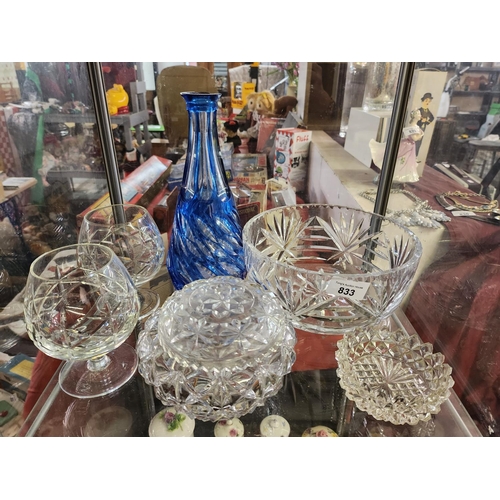 833 - A nice collection of cut glass and crystal items, includes a large bowl, two brandy glasses, a blue ... 