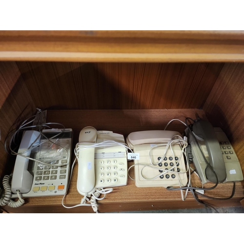 846 - A collection of four vintage land line telephones.