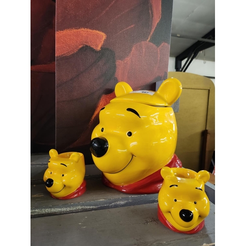 867 - Disney Winnie the Pooh cookie jar and pair of egg cups. In excellent condition