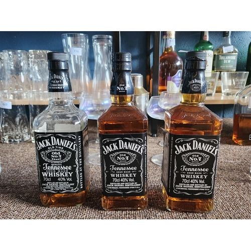 121 - Three Jack Daniels bottles with contents, one unopened