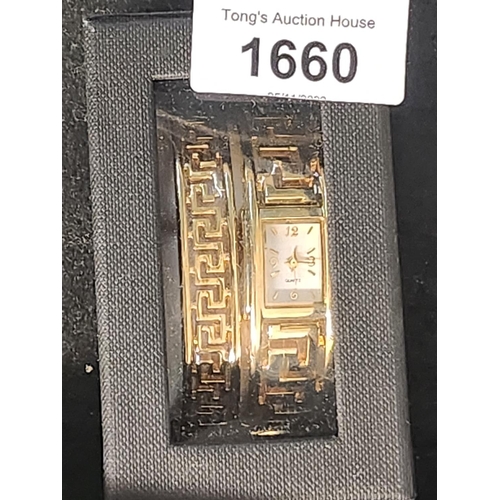 1660 - **LAST CHANCE ITEM**IMMACULATEA gold tone ladies quartz watch and matching bracelet, with Greek key ... 