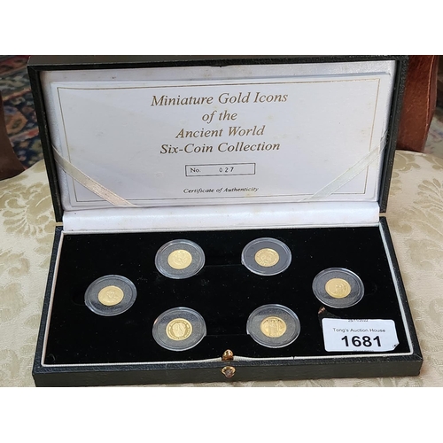 1681 - A collection of six miniature gold coins of Icons of the ancient world. in presentation box scraps a... 