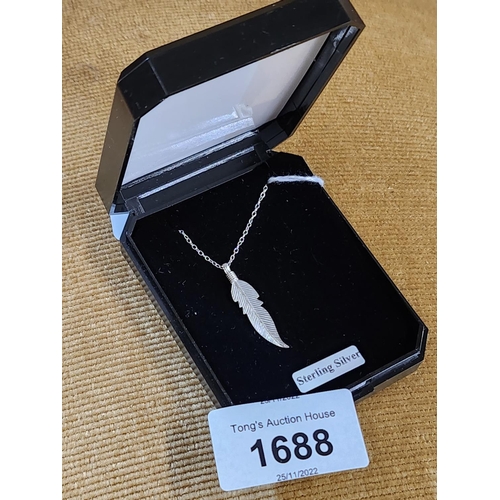 1688 - A delicate sterling silver necklace with fine leaf pendent. In box