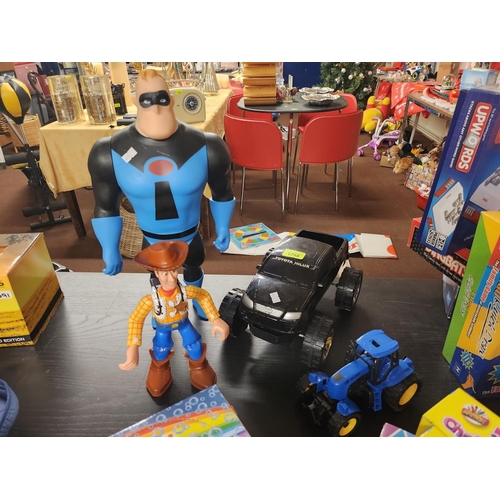 1758 - Large Mr incredible figure, Toy Story Woody figure and Toyota Hilux car