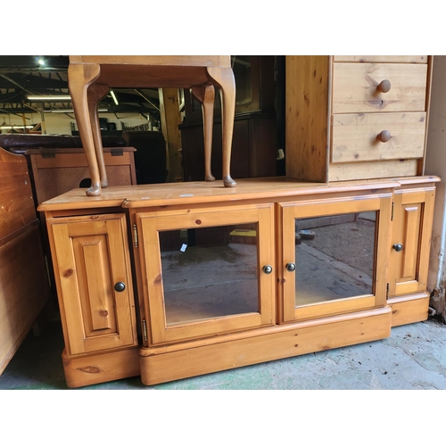 1642 - Pine double fronted media display cabinet *