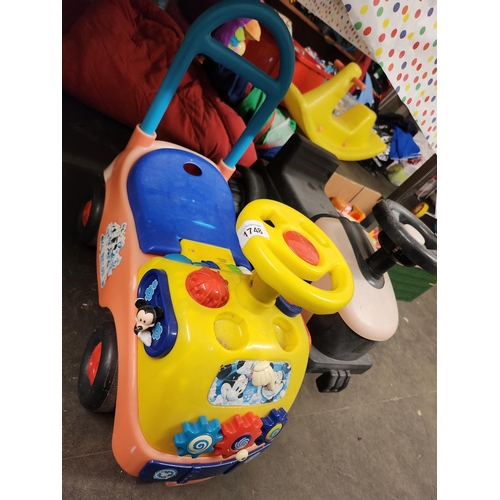 1748 - Two small sit on wheely toys.
One a tractor and the other a colourful truck