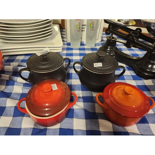 Collection of four Le Creuset lidded pots