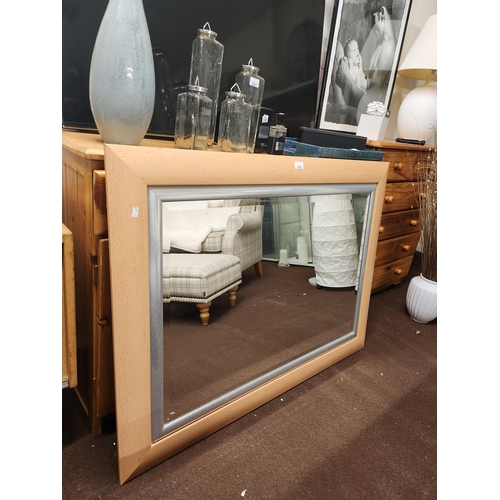 2062 - Large beech wood framed Hamilton bevelled mirror. Approximately 106 x 84 cm