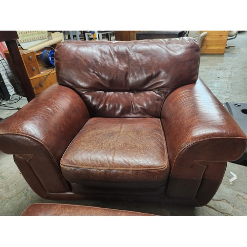 2083 - Very Large leather armchair great condition with matching foot stool lovely patina