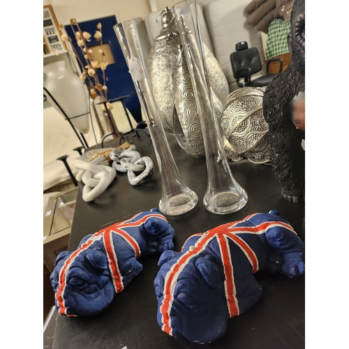 2033A - Pair of British Bulldog concrete ornaments and 2 tall glass stem vases