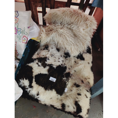 598 - A large faux fur throw and a pair of faux shaggy cushion covers