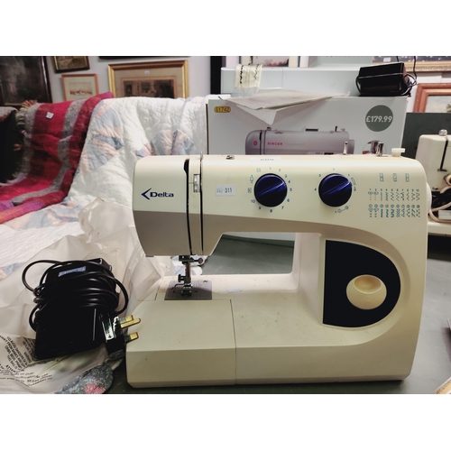 600 - A Delta electric sewing machine.