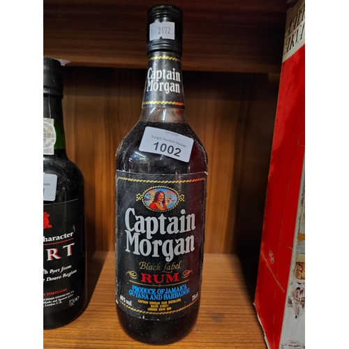 1002 - Vintage bottle with contents Captain Morgan rum