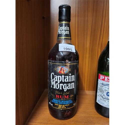 1005 - Vintage bottle and contents of Captain morgan