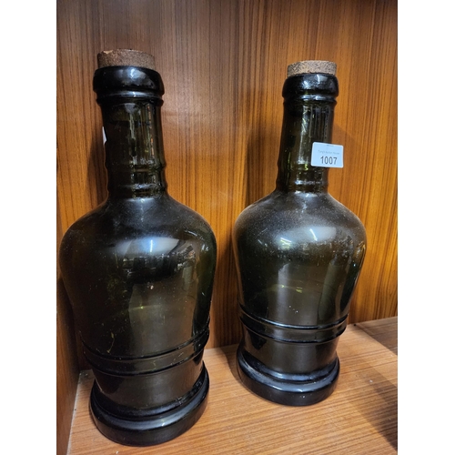 1007 - 2 large vintage bottles corked