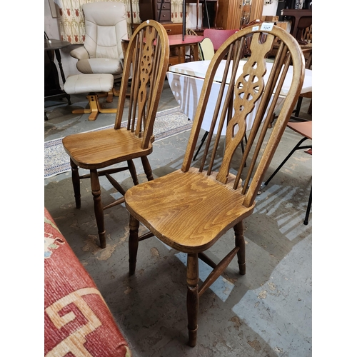 1247 - 2 vintage solid wheelback chairs