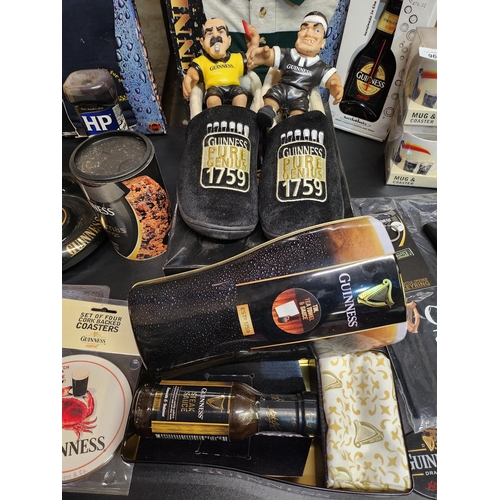 964 - Brand new pair of Guinness slippers size 7 and other Guinness items