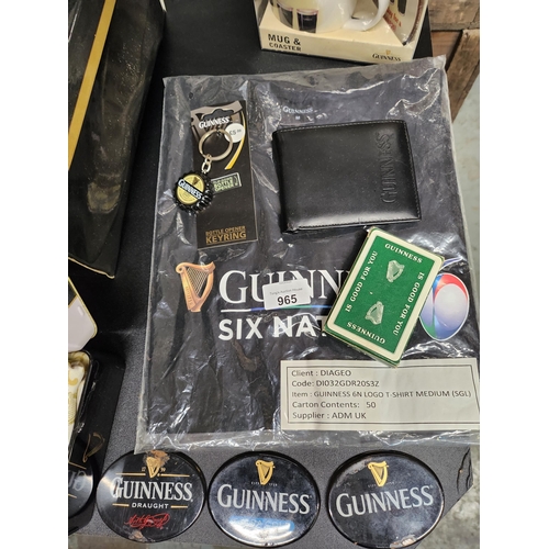 965 - Large collection of Guinness items including badges T shirts playing cards wallet and keyring