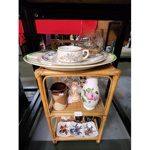 625A - A collection of ceramic and glass items including large oval plates, small jugs and ash trays