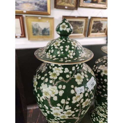 760 - Pair of large Chinese Porcelain green tall lidded ginger jars hand painted with prunus flowers paint... 