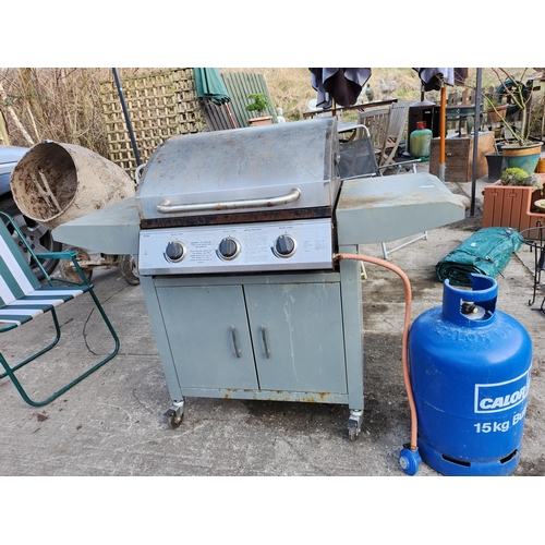 22 - Gas three burner barbecue with gas bottle