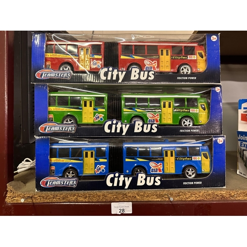 28 - Three boxed Teamsters City Bus models in red, green and blue