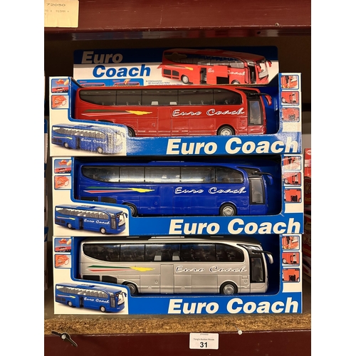 31 - Three boxed Euro Coaches item number 2002 in red, blue and silver