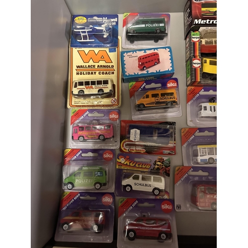 66 - Collection of various model vehicles including Wallace Arnold Holiday Coach, Siku Alligator Farm bus... 