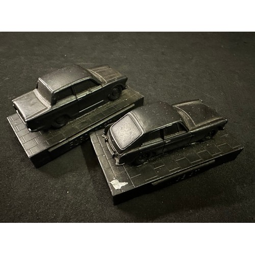 27 - Two model car figures made from coal including Ford Cortina and MGB GT