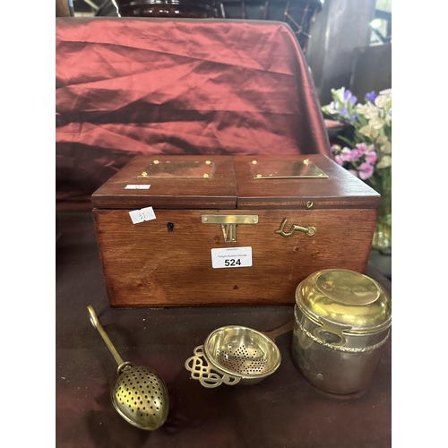 524 - Wooden tea caddy with two compartments and tea making set