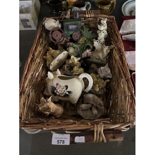 578 - Wicker basket with contents of collectable pig items