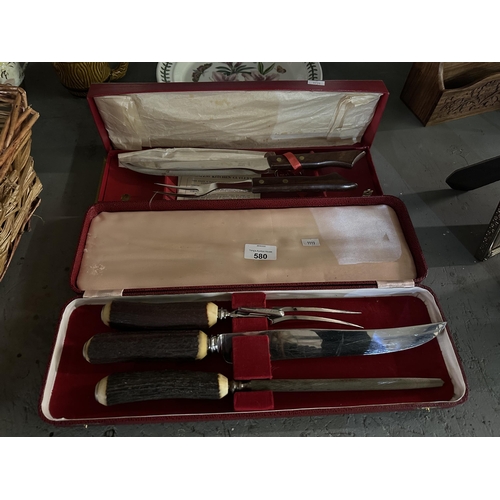 580 - Horn handled carving set and wood handled set