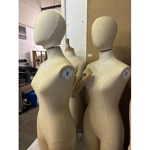 715 - Three female Torso mannequins, two with removable heads and one with removable adjustable wooden arm... 