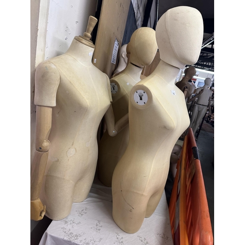 715 - Three female Torso mannequins, two with removable heads and one with removable adjustable wooden arm... 