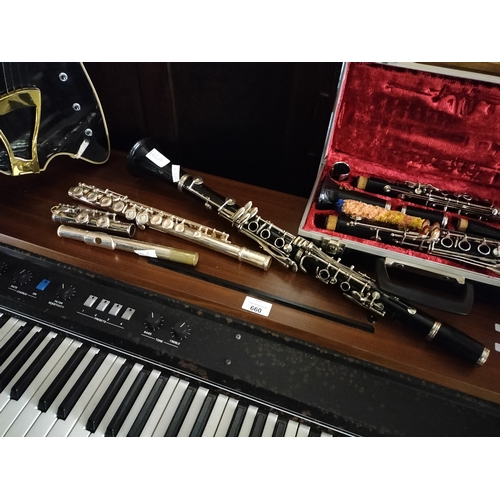 662A - A Regent England clarinet in case, a second clarinet and a flute made in Elkhart USA. 3 items in tot... 
