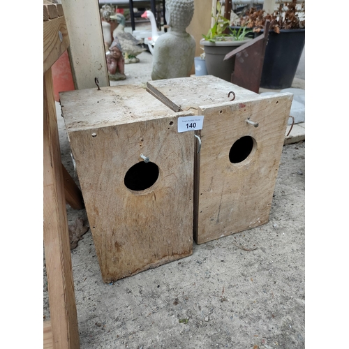 140 - 2 wooden bird boxes.