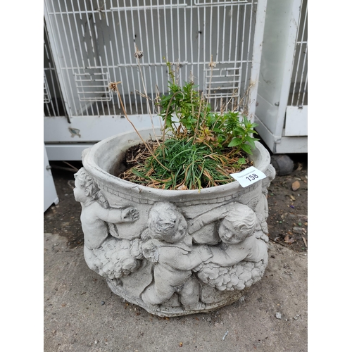 158 - Cherub concrete planter with plant.