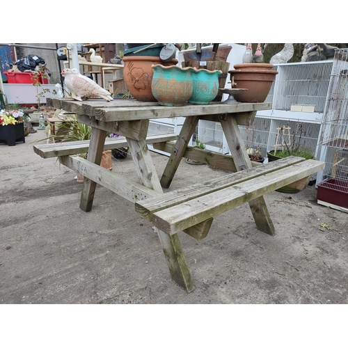 165 - Solid wooden picnic table. 120cm width.