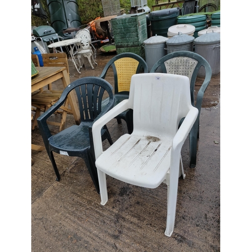 246 - Four plastic garden chairs