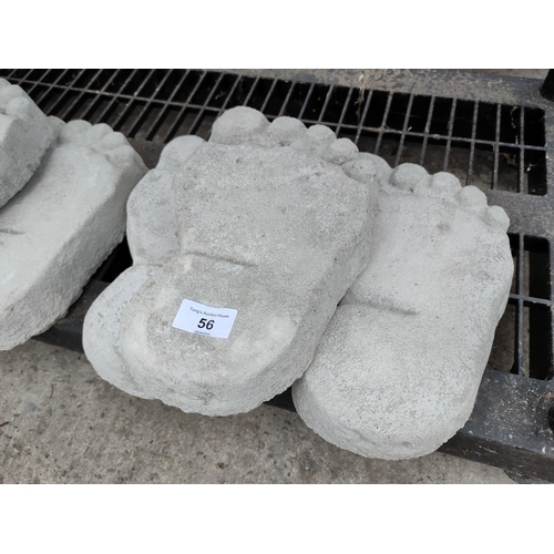 56 - 3 concrete stepping stones in the form of feet