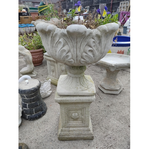 97 - Beautiful stone garden planter on stone plinth with winter pansies 33