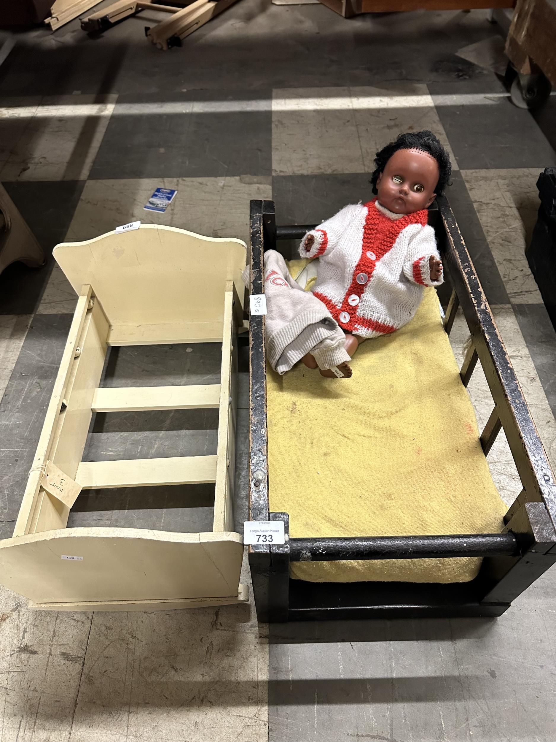 Two vintage wooden dolls cots and vintage doll