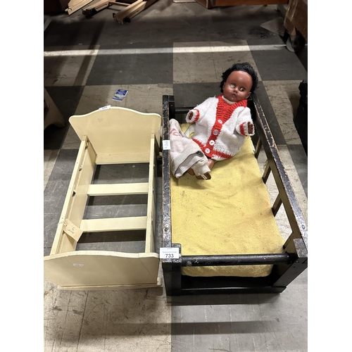 Two vintage wooden dolls cots and vintage doll