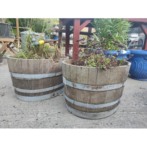 31 - Pair of wooden Barrell planters , 1 with old tap