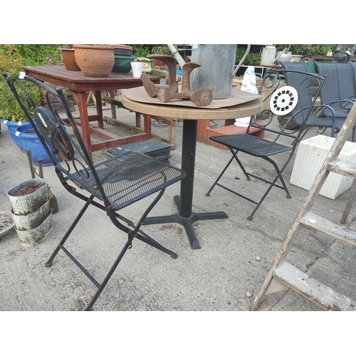 36 - 2 folding metal chairs and a round table